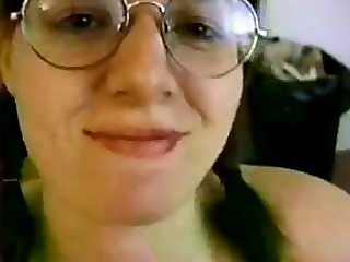 Brunette with glasses strokes and takes cum 