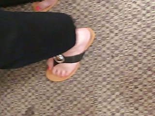 Wife's sexy feet cute and sexy shoes at the register